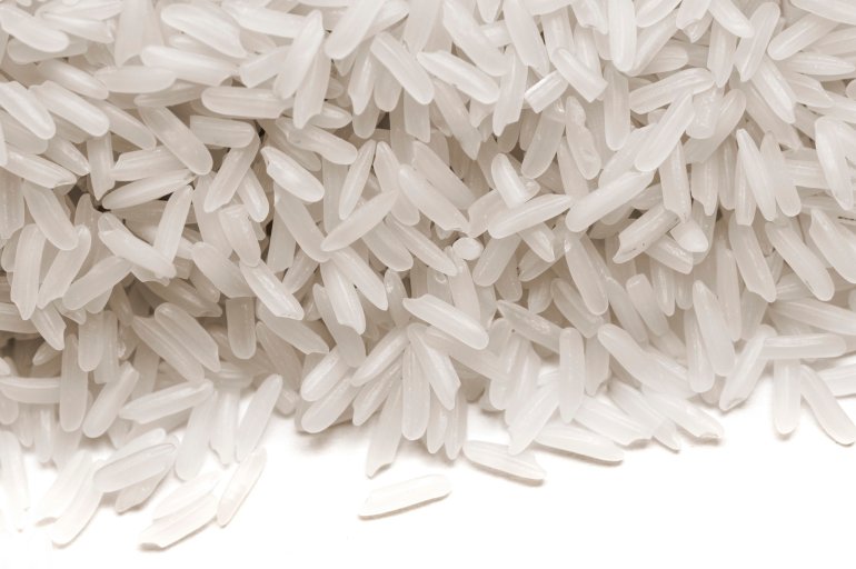 Long-grain white rice, a cereal grain high in calories and a worldwide staple in nutrition and diet which is often parboiled before being sold to consumers