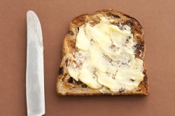 Slice of bread with spreading butter