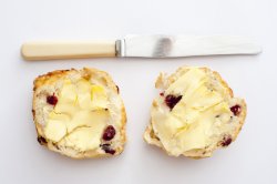 Photo of two scones with butter