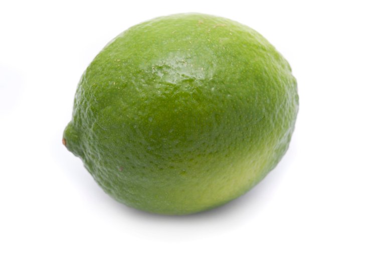 Whole fresh green lime used as an ingredient in cooking for its sour tangy taste and a healthy source of vitamin c