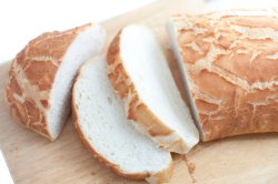 Sliced fresh white crusty bread loaf