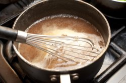 Gravy simmering in sauce pan