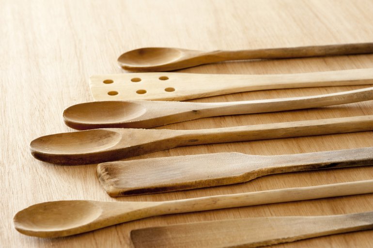 Selection of plain wooden rustic kitchen utensils Free Stock Image
