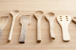 Set of plain wooden kitchen spoons and spatulas