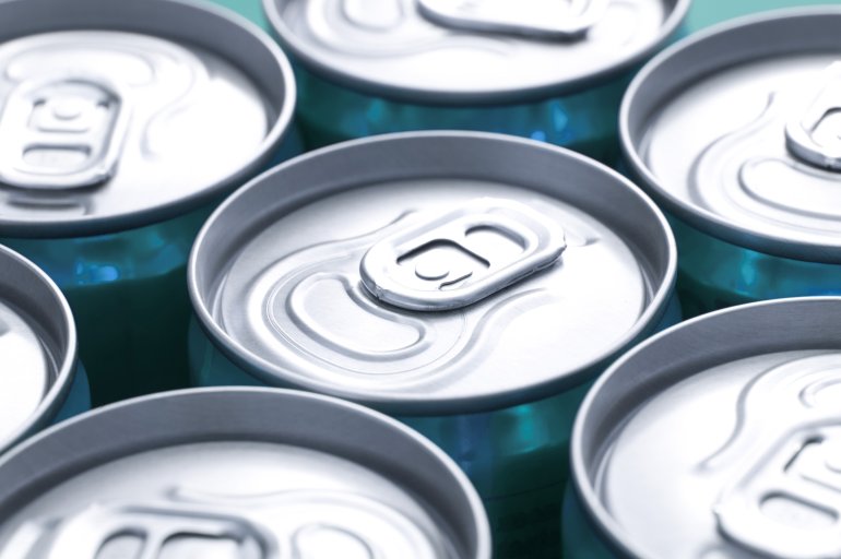 Ring pulls on beverage cans Close up view of plain silver ring pulls on closely arranged beverage cans with focus to one can in the centre