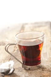 Brewing tea in a glass mug