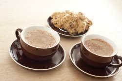 Two cups of coffee with cake