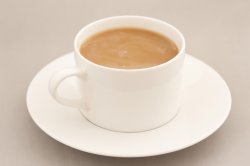 Cup of fresh milky coffee