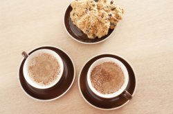 Cappuccino coffee with a tasty snack