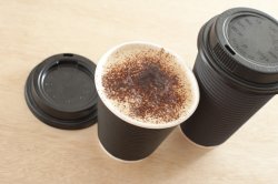 Two takeaway cups of cappuccino coffee