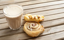 Latte coffee with fresh Danish pastries