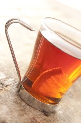 Glass mug of lemon tea
