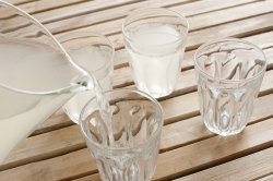 Pouring glasses of fresh homemade lemonade