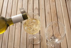 Pouring a glass of white wine