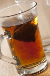 Teabag brewing in a mug of boiling water