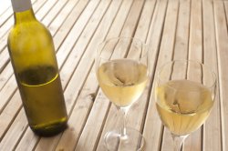 Glasses of white wine and a bottle