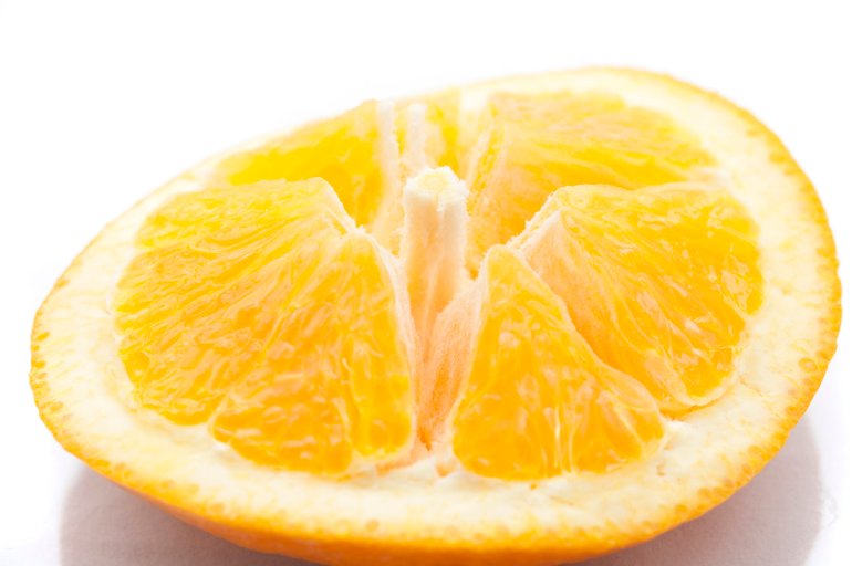 Sliced orange showing the structure of the fleshy pulp and segments on the rind