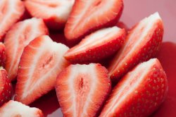 Close up view of halved strawberries