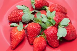 Plate of juicy ripe strawberries