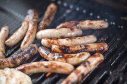 Sausages on thick barbecue grid