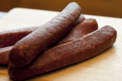 Close-up of four sausages