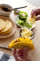 Man preparing corn tortillas
