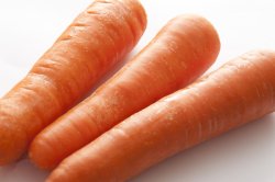 Trio of fresh raw carrots